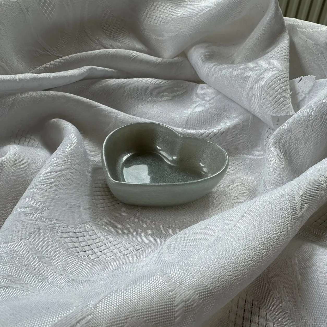 Herzschale oliv Vorderseite